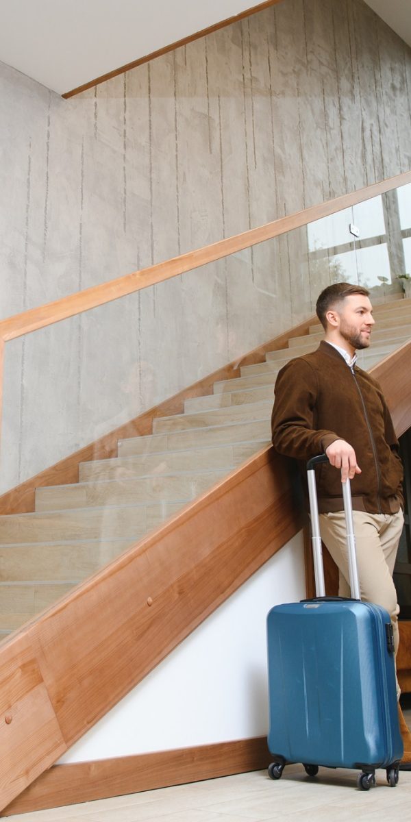 Couple on a business trip doing check-in at the hotel.
